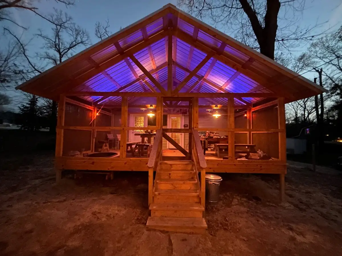 The front porch lit up at dusk